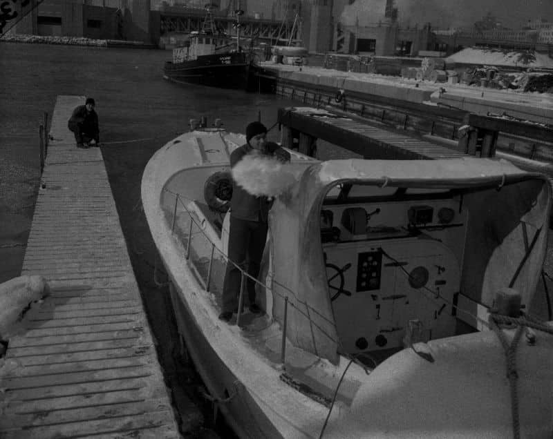 10495. (negative) Removing Snow from 36-foot MLB c.1950-1960