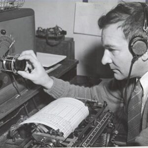 1797. (photo) Radio Operator Ralph B. Elliott answering SOS calls at the Marine Radio Station at Chatham, Mass. c.1941.